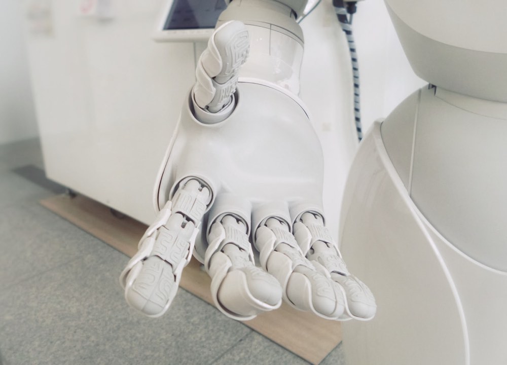 Humanoid and quadruped robots demonstrating manipulation and mobility tasks in a public hall